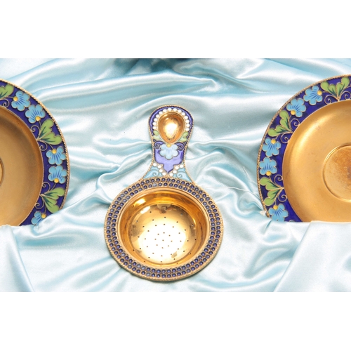 448 - A 20TH CENTURY CASED RUSSIAN SILVER GILT AND ENAMEL TEA SERVICE comprising of a large bowl, six cups... 