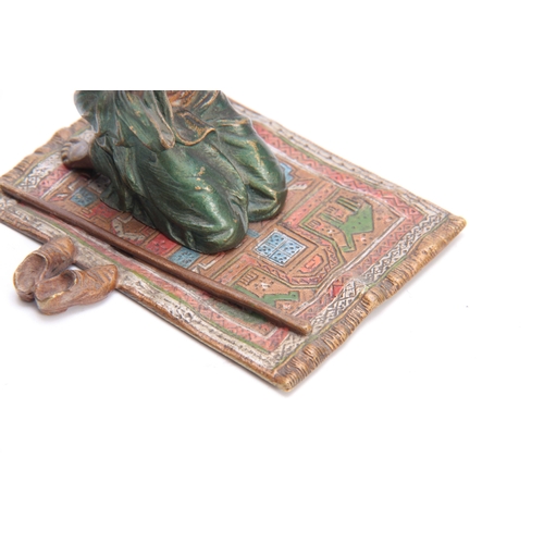 458 - FRANZ BERGMAN AN EARLY 20th CENTURY AUSTRIAN COLD PAINTED BRONZE modelled as a praying Arab knelt on... 