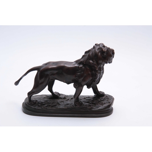 464 - A LATE 19TH CENTURY BRONZE SCULPTURE OF A LION mounted on a naturalistic base 30cm wide 21.5cm high.