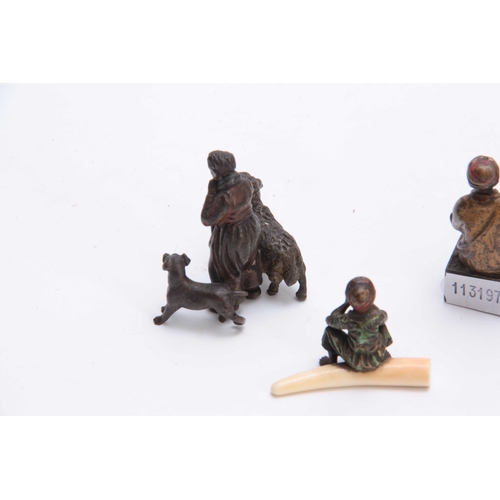 466 - A COLLECTION OF THREE EARLY 20th CENTURY COLD PAINTED BRONZE FIGURES modelled as an Arab bookseller,... 