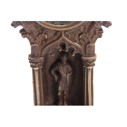 492 - A 19TH CENTURY GOTHIC STYLE BRONZE POCKET WATCH HOLDER depicting a guardsman on a stepped plinth 21c... 