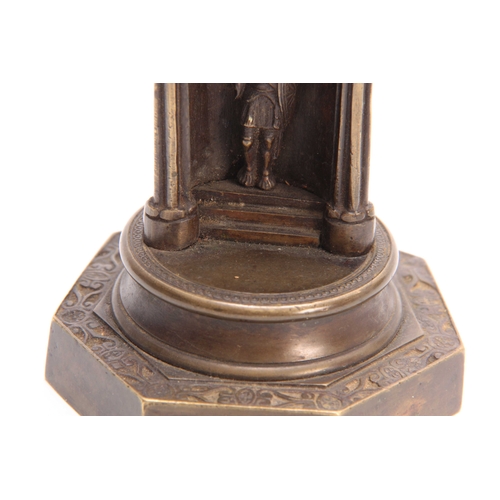 492 - A 19TH CENTURY GOTHIC STYLE BRONZE POCKET WATCH HOLDER depicting a guardsman on a stepped plinth 21c... 