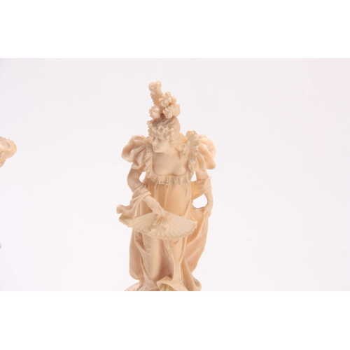 498 - A FINE PAIR OF 19TH CENTURY EUROPEAN CARVED IVORY FIGURES depicting a Lady and a Gentleman in fine d... 