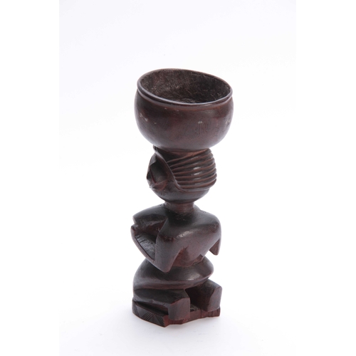 501 - AN AFRICAN TRIBAL CARVED HARDWOOD GOBLET depicting a nude lady 28cm high.