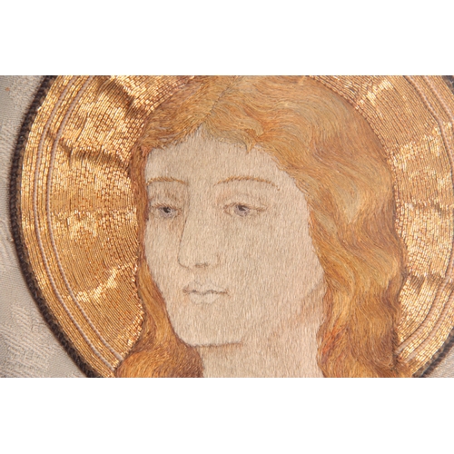 512 - A 19TH CENTURY PRE-RAPHAELITE STYLE EMBROIDERED BUST PORTRAIT WITHIN A GOLD COUCHWORK HALO the sitte... 