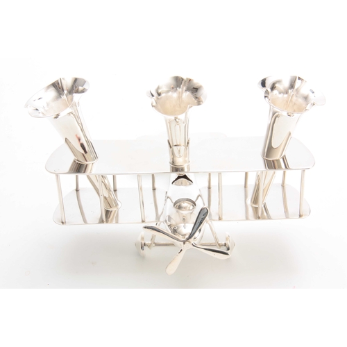 516 - A CHROME ART DECO NOVELTY TRIO POSY VASE modelled as a biplane with three removable fluted vases, ta... 