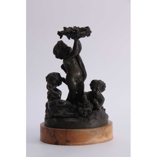 524 - A 19TH CENTURY FRENCH BRONZE SCULPTURE modelled as cupids amidst fruiting vines - on a Sienna marble... 