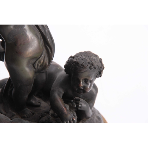 524 - A 19TH CENTURY FRENCH BRONZE SCULPTURE modelled as cupids amidst fruiting vines - on a Sienna marble... 