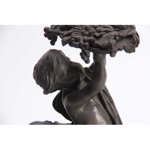 524 - A 19TH CENTURY FRENCH BRONZE SCULPTURE modelled as cupids amidst fruiting vines - on a Sienna marble... 