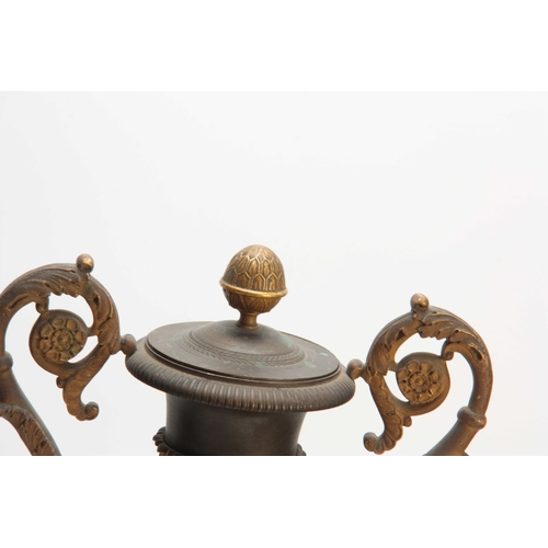 529 - A PAIR OF REGENCY BRONZE AND ORMOLU ADAM STYLE URNS / CANDLEHOLDERS having reversible tops and scrol... 