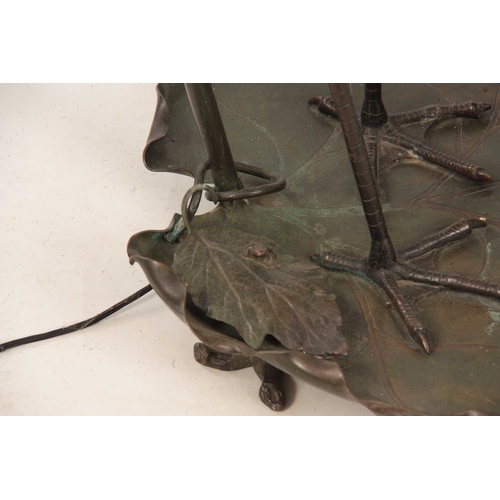 542 - AN ART NOUVEAU GREEN PATINATED BRONZE STANDARD LAMP depicting a Crane stood on a large Lilly pad 149... 