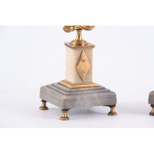 549 - A PAIR OF 19TH CENTURY FRENCH BRONZE, ORMOLU AND MARBLE CANDLESTICKS with square bases and winged ea... 