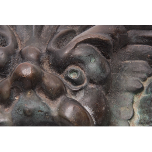 553 - A 19TH CENTURY BRONZE FOUNTAIN MASK 28cm wide 23cm high.