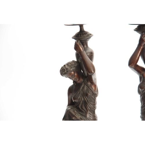 554 - A PAIR OF LATE 19TH CENTURY FRENCH BRONZE FIGURAL CANDELABRA DEPICTING CLASSICAL WATER CARRIERS  mou... 