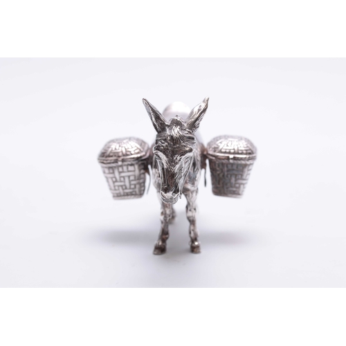 561 - AN UNUSUAL LATE 19TH CENTURY CONTINENTAL SILVER CRUET SET realistically modelled as a saddled donkey... 