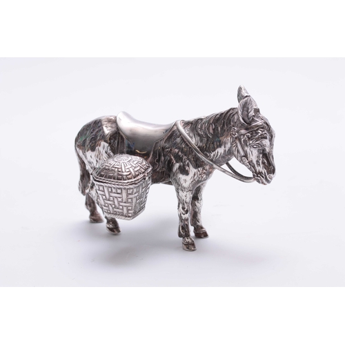 561 - AN UNUSUAL LATE 19TH CENTURY CONTINENTAL SILVER CRUET SET realistically modelled as a saddled donkey... 