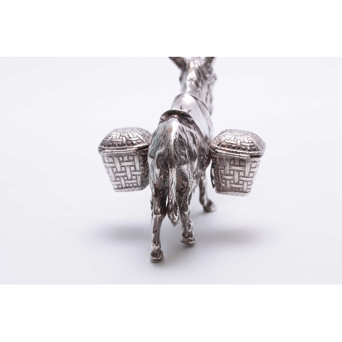 561 - AN UNUSUAL LATE 19TH CENTURY CONTINENTAL SILVER CRUET SET realistically modelled as a saddled donkey... 