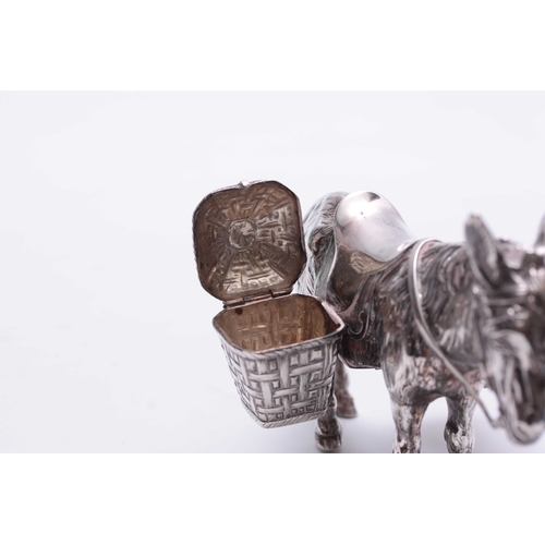 561 - AN UNUSUAL LATE 19TH CENTURY CONTINENTAL SILVER CRUET SET realistically modelled as a saddled donkey... 