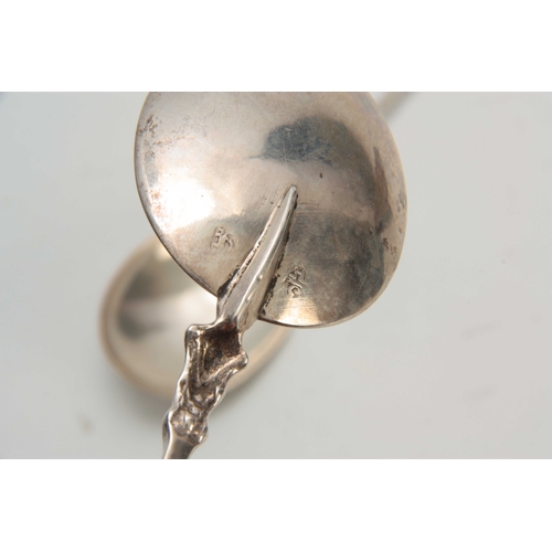 600 - A PAIR OF SILVER AURICULAR SPOONS POSSIBLY AMERICAN with oval rat-tail bowl and pyramidal foliate st... 