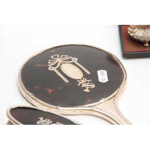 604 - A SELECTION OF SILVER ITEMS INCLUDING a Dressing table Mirror, Sheild Pendant, Dressing Table Brush,... 