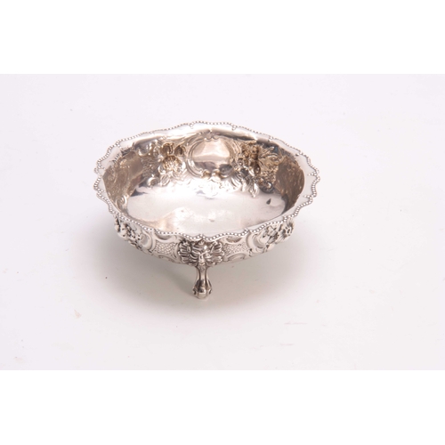 608 - A LATE 19th CENTURY SILVER EMBOSSED SUGAR BOWL with a beaded rim and foliate decoration on three lio... 