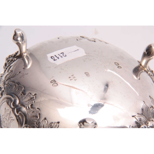 608 - A LATE 19th CENTURY SILVER EMBOSSED SUGAR BOWL with a beaded rim and foliate decoration on three lio... 