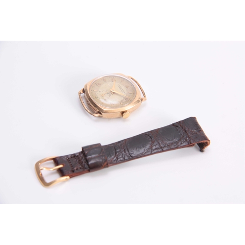 651 - WINEGARTENS, LONDON E.C. 2. A GENTLEMANS VINTAGE 9CT GOLD WRIST WATCH the tank shaped case enclosing... 