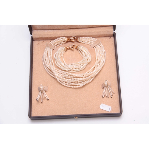 654 - A CASED SET OF CULTURED PEARL DRESS JEWELLERY comprising a multi string necklace with gold metal and... 