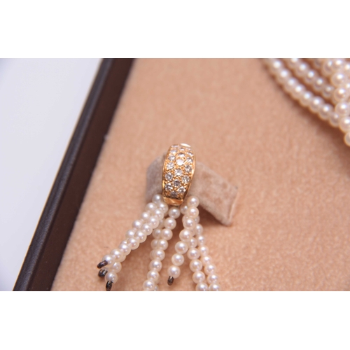 654 - A CASED SET OF CULTURED PEARL DRESS JEWELLERY comprising a multi string necklace with gold metal and... 