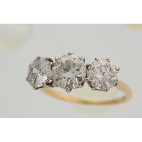 657 - AN 18CT YELLOW GOLD CLAW SET THREE STONE DIAMOND RING total ct weight 3.75, centre stone 1.75ct