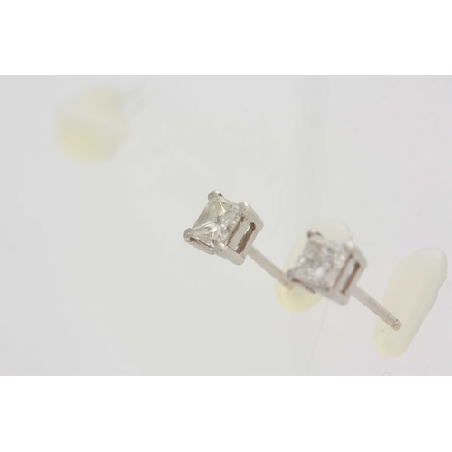 674 - A PAIR OF WHITE GOLD SQUARE CLAW SET DIAMOND SOLITAIRE EAR STUDS