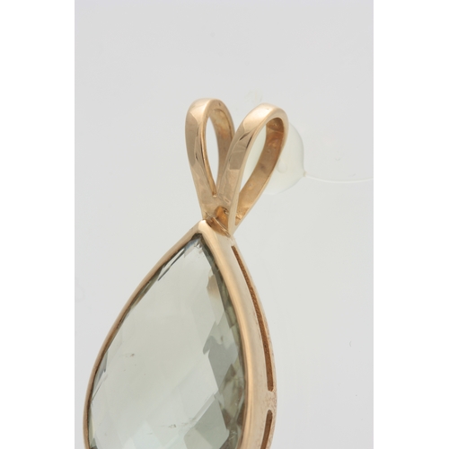 675 - A YELLOW GOLD MOUNTED TEARDROP SHAPED PENDANT set with a large facet-cut clear semi-precious stone 3... 