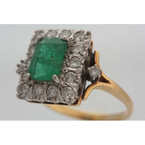 678 - AN 18CT YELLOW GOLD EMERALD AND DIAMOND CLUSTRE RING with raised centre stone and rectangular border... 