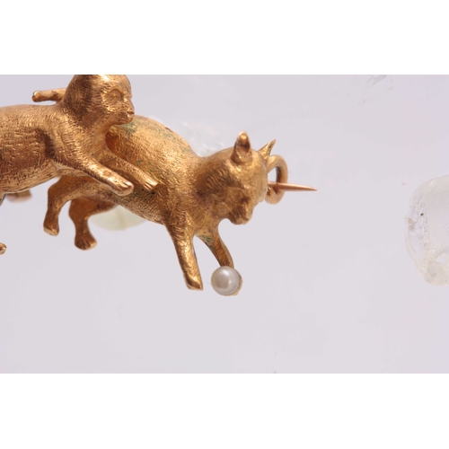 690 - A 15CT GOLD AND PEARL CAT BROOCH having two cats playing with a ball - tested 15ct gold 3cm wide.