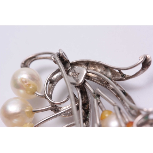 695 - A STYLISH 14CT WHITE GOLD AND PEARL SET BROOCH - hallmarked 14ct 5.5cm wide