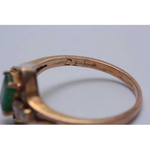 696 - AN 18CT GOLD RING AND EARRINGS SET WITH DIAMONDS AND EMERALDS - tested 18ct gold