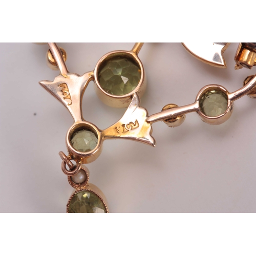 700 - A FINELY MADE 9CT GOLD PERIDOT AND PEARL SET BROOCH - hallmarked 9ct gold 3.5cm wide 4.5cm overall.