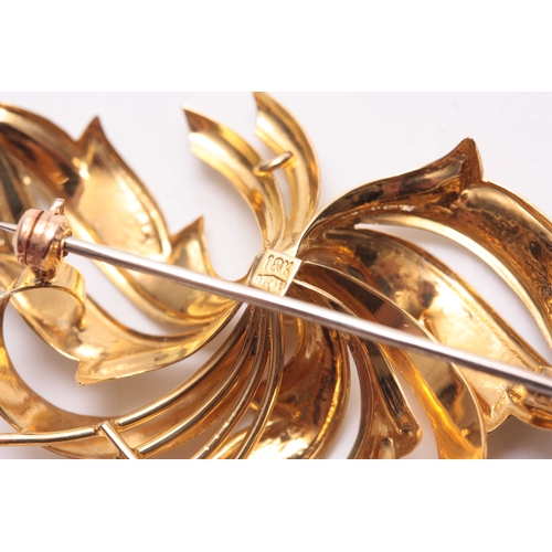 706 - AN 18CT GOLD AND RUBY SET BROOCH designed as leaves and berries - hallmarked 18ct 52mm wide.