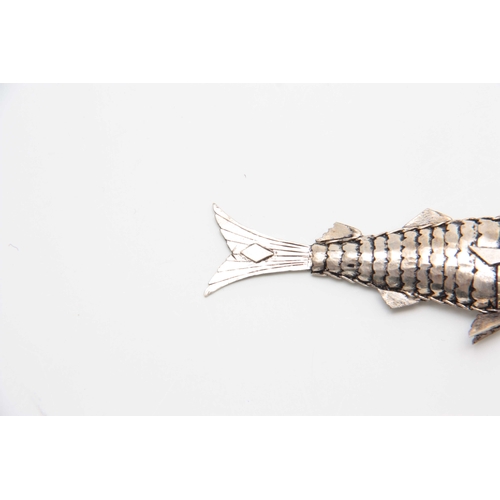 707 - A SILVER RETICULATED FISH 9.5cm overall