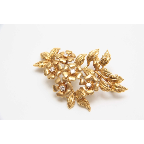 709 - AN 18CT YELLOW GOLD FLOWERHEAD AND LEAF SPRAY BROOCH set with five diamonds