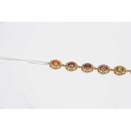 710 - A 9CT GOLD FILIGREE MULTI-COLOURED STONES BRACELET 17.5cm across