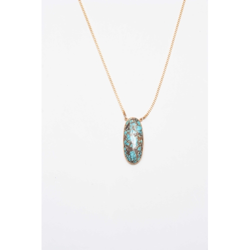 717 - A .375 HALLMARKED YELLOW GOLD SLENDER NECK CHAIN AND LARGE OVAL TURQUOISE PENDANT 49.5cm long