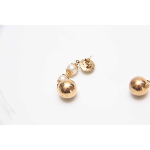 724 - A PAIR OF YELLOW GOLD AND PEARL EARRINGS with ball drops 4.5cm overall