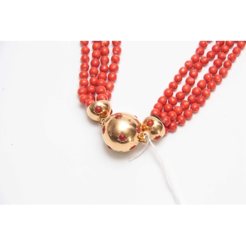 728 - AN 18CT YELLOW GOLD AND MULTI STRING CORAL BEAD NECKLACE with diamond star-spangled ball fastener an... 