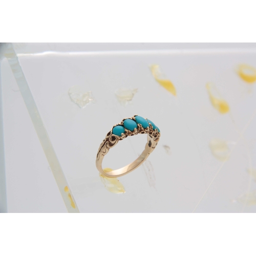 731 - A YELLOW GOLD AND GRADUATED FIVE STONE SET TURQUOISE DRESS RING with leaf work shank