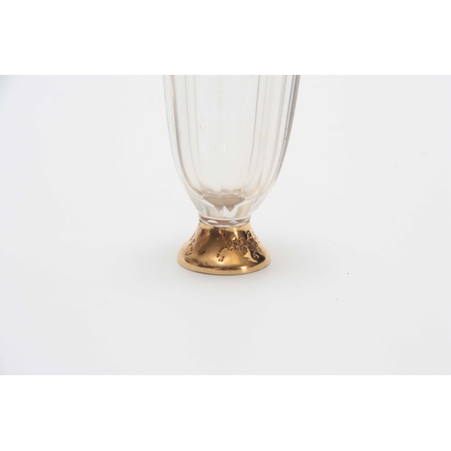 735 - AN 18CT GOLD MOUNTED PERFUME BOTTLE with tapering faceted clear body, florally embossed foot and sho... 