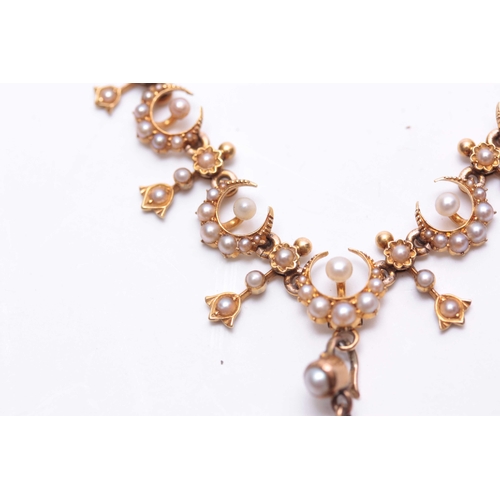 743 - A LATE 19TH CENTURY YELLOW GOLD AND SEED PEARL NECKLACE MADE FOR THE TURKISH MARKET on fine cable tw... 