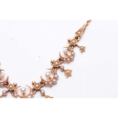 743 - A LATE 19TH CENTURY YELLOW GOLD AND SEED PEARL NECKLACE MADE FOR THE TURKISH MARKET on fine cable tw... 