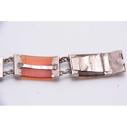 746 - A SCOTTISH SILVER MOUNTED COLOURED HARDSTONE BRACELET of double sectional form with overall engraved... 