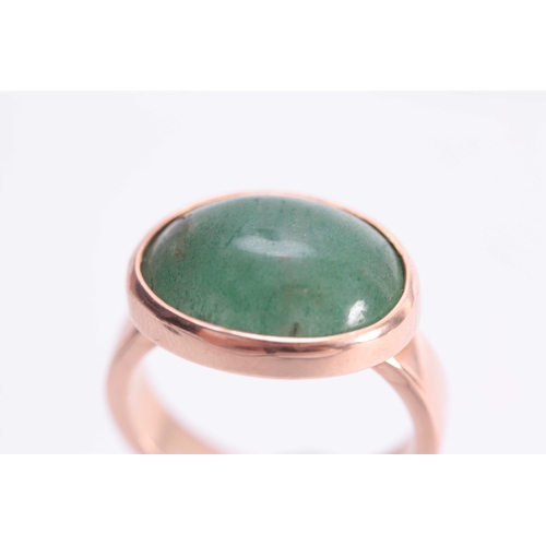 747 - A 9ct .375 hallmarked YELLOW GOLD DRESS RING with large oval cushion shaped jade stone inset